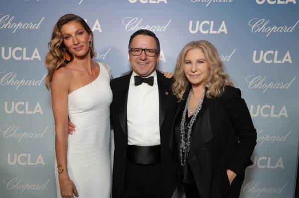 A photo of Anthony Pritzer with Gisele Bundchen and Barbra Streisand in 2019.