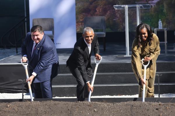 A photo of Gov. JB Pritzker with President Barack Obama and Michelle Obama.