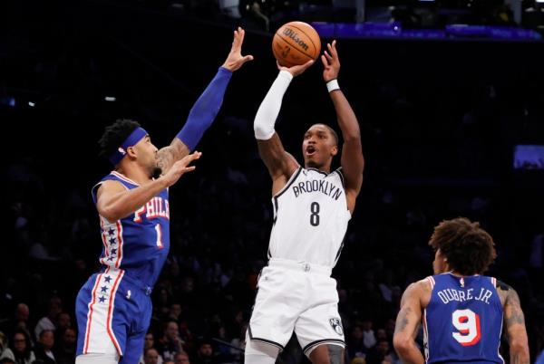 Brooklyn Nets guard Lo<em></em>nnie Walker IV shoots the ball against the 76ers on Tuesday night.
