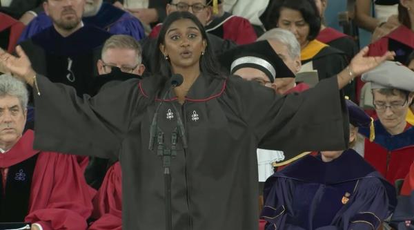 Kumar holds out her arms while delivering her impassio<em></em>ned speech from the podium