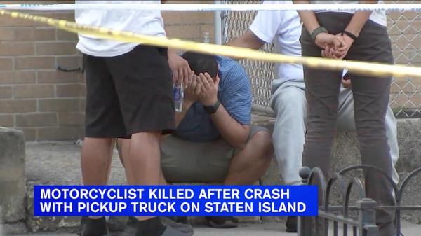A person is seen in distraught following the fatal motorcycle accident in Staten Island on Sep. 3, 2023.