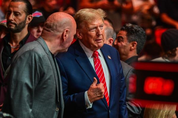 Trump and UFC President Dana White talk cageside during UFC 299 in Miami, Florida on Saturday.