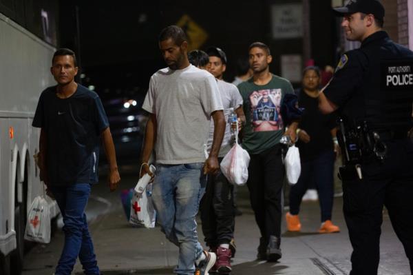 Migrants traveling on a bus from Texas arrive at Port Authority