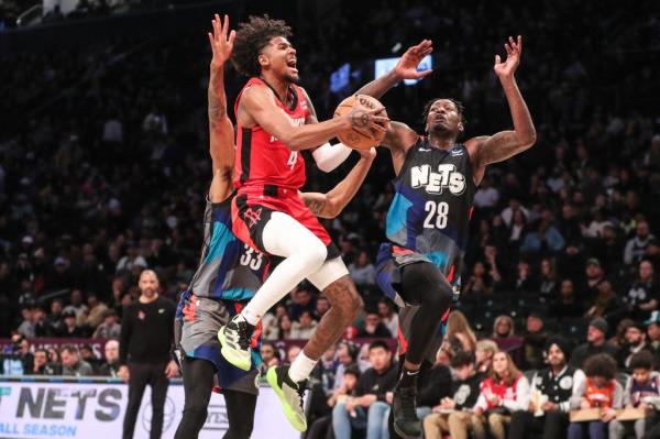 Dorian Finney-Smith (28) of the Nets was injured during a game against the Rockets on Jan. 27, 2024.