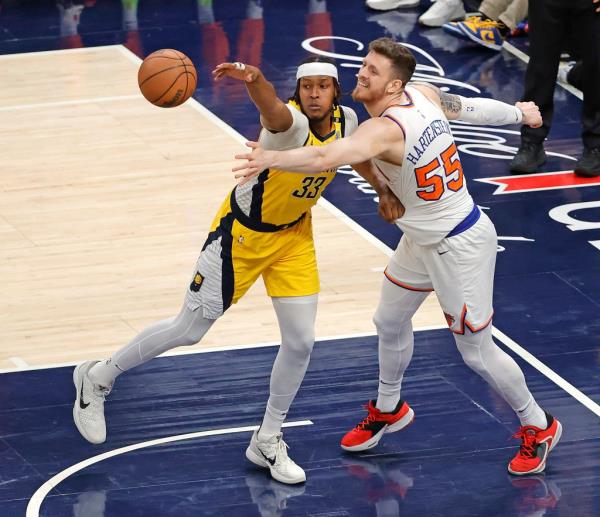 Myles Turner #33 of the Indiana Pacers knocks the rebound away from Isaiah Hartenstein #55 of the New York Knicks during the first quarter.