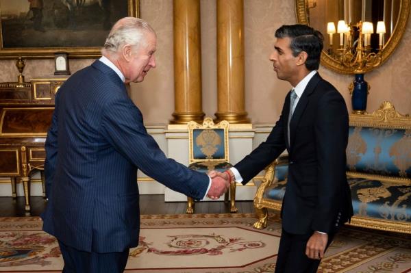 King Charles III welcomes Rishi Sunak during an audience at Buckingham Palace, London, wher<em></em>e he invited the newly elected leader of the Co<em></em>nservative Party to become Prime Minister and form a new government, Tuesday, Oct. 25, 2022