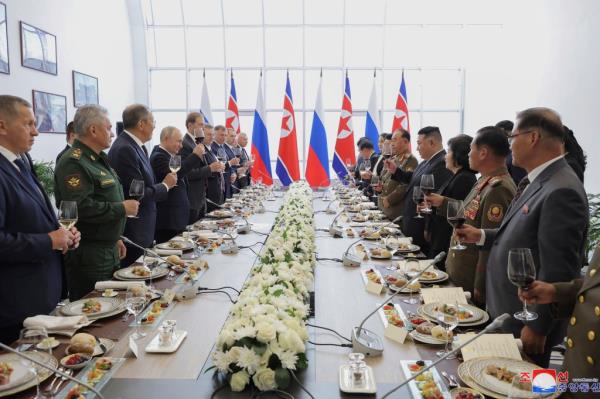 Russian President Vladimir Putin and North Korean leader Kim Jong Un, fourth right, toast after their talk at the Vostochny cosmodrome outside the city of Tsiolkovsky on Sep. 13, 2023.