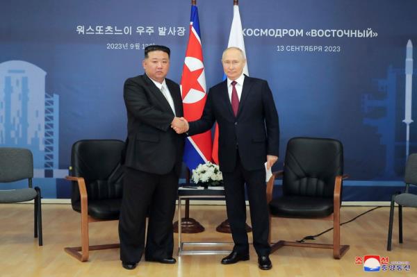 North Korean leader Kim Jong Un, left, and Russian President Vladimir Putin shake hands before their talk at the Vostochny cosmodrome in the far eastern Amur region, Russia, on Sep. 13, 2023. 