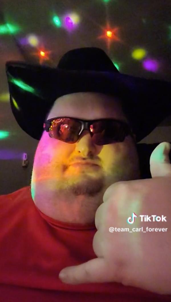 Carl Eiswerth wearing a cowboy hat doing thumbs up