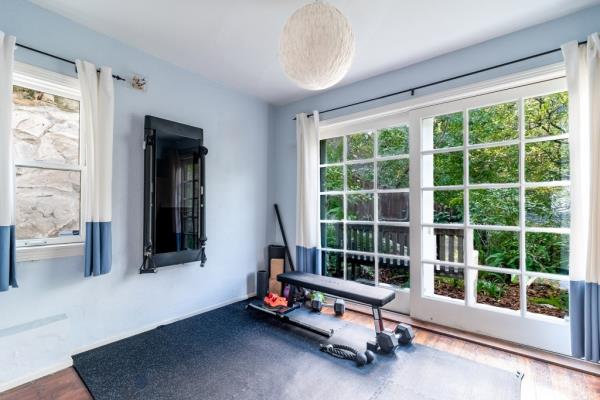 A third bedroom currently used as a workout space. 