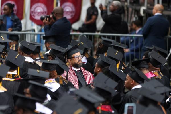 A Morehouse College class of 2024 graduate turns his back