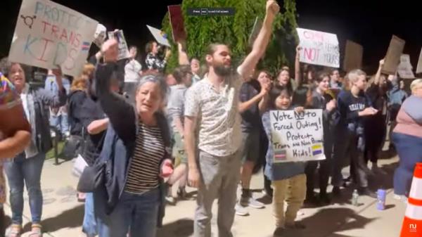 Protesters chanted and held signs outside of the Middletown Board of Education vote to adopt a policy that notifies parents if their children are transgender.