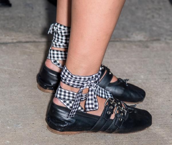 Photo of black ballet flats with gingham ties. 