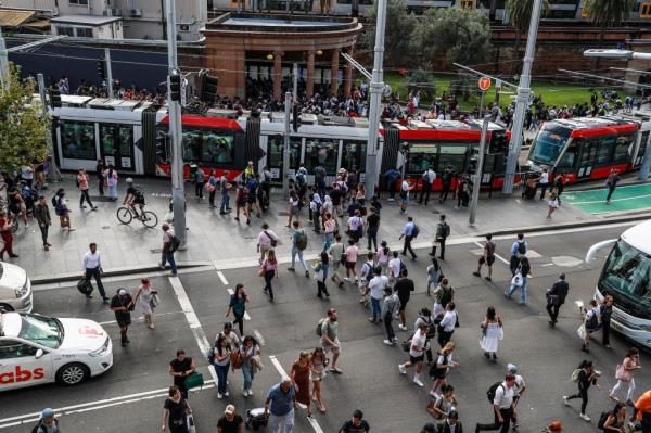 SYDNEY, AUSTRALIA - MARCH 08: Commuters wait outside Central Station on March 08, 2023 in Sydney, Australia. Sydney trains ground to a halt shortly before the afternoon peak due to an unspecified communications issue, according to media reports. Even after some service resumed, commuters were being advised to make other arrangements. (Photo by Roni Bintang/Getty Images)
