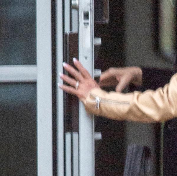 Theresa Nist wearing her wedding ring while opening a door, engagement ring absent, after announcement of breakup with Gerry Turner.