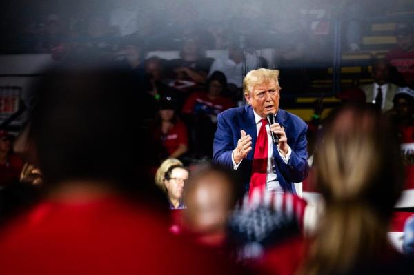 Former US President Do<em></em>nald Trump addressing a crowd at a town hall event in Flint, Michigan, 2024