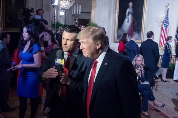 President Do<em></em>nald Trump appears on Fox & Friends co-host Pete Hegseth at a Wounded Warrior Project Soldier Ride event in the East Room of the White House in Washington, April 6, 2017.