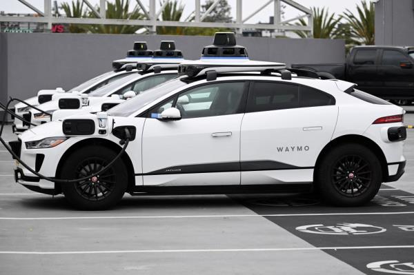 A Waymo auto<em></em>nomous self-driving Jaguar electric vehicle at a charging station in Los Angeles on May 15, 2024.
