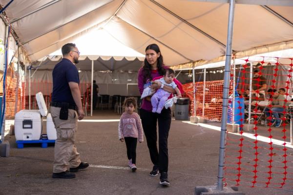 Migrants arrive at the Regio<em></em>nal Center for Border Health in Yuma, Arizona, after being released by Border Patrol agents.