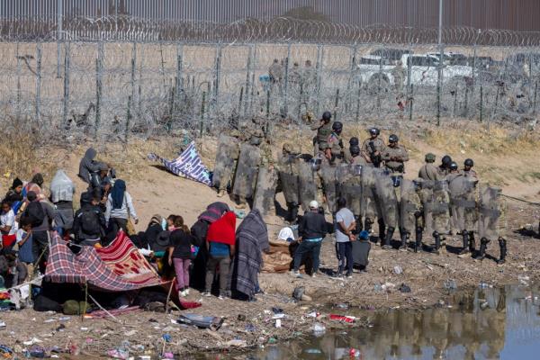 Texas officials beefed up security at the border in El Paso by deploying additio<em></em>nal Natio<em></em>nal Guard troops, State Troopers, and other law enforcement after migrants waiting in this area stormed the border fence yesterday.