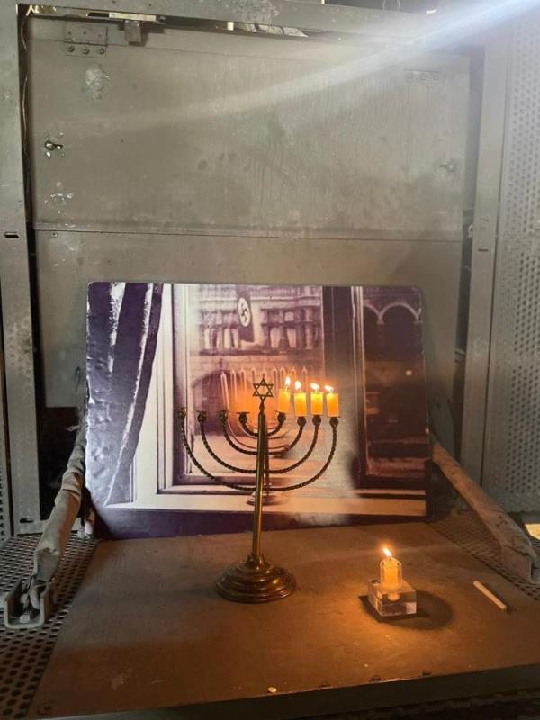 Menorah in front of photo of the same menorah from 1931