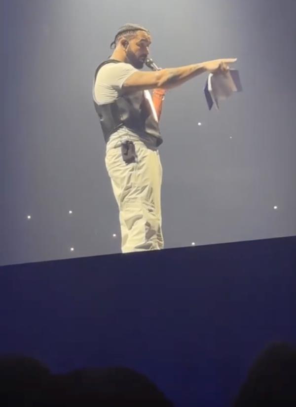 Drake issued a warning to a fan after a book was thrown at him on stage.