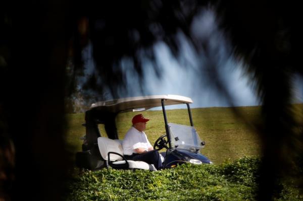 U.S. President Do<em></em>nald Trump plays golf at the Trump Internatio<em></em>nal Golf Club in West Palm Beach, Florida, U.S., December 28, 2020.