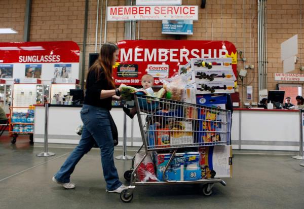 A woman pushing a shopping cart with a child at a Costco Wholesale store in Glendale, Calif. on Feb. 28, 2011