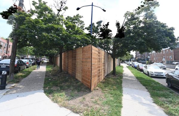 Most of the fence is already up, and workers don't think vagrants will be able to scale it.
