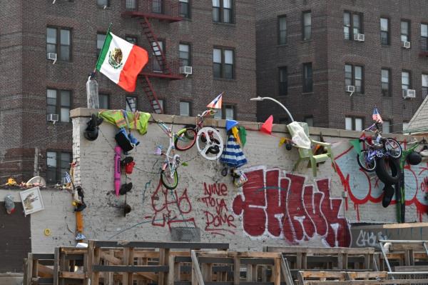 A picture showing graffiti and trash on top of the Rite Aid.