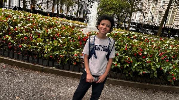 11 year-old Cayden Thompson standing outside in a 