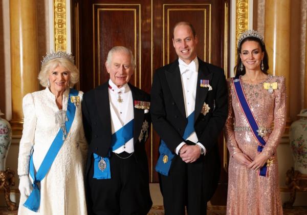 King Charles III, Queen Camilla, Prince William, and Catherine, Princess of Wales, posing for a photograph at the Diplomatic Reception in Buckingham Palace