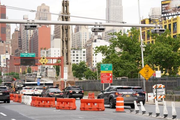 A general view of a co<em></em>ngestion pricing toll gantry with the Empire State Building 