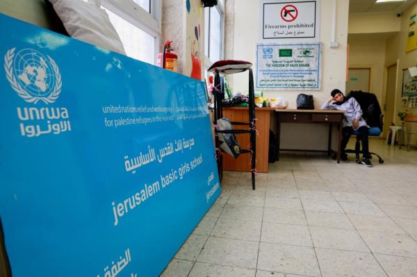 A Palestinian girl waits by the entrance to the UNRWA Jerusalem Girls' School in the Silwan neighbourhood of East Jerusalem, January 30, 2024. 