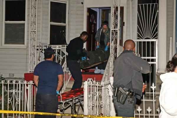 Police carry out victims of the Brooklyn home.
