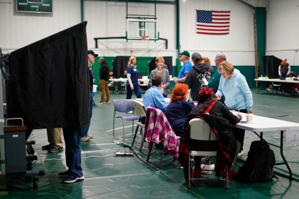 Voters check in at their polling place before casting their ballots on election day in Philadelphia on Nov. 7, 2023. 