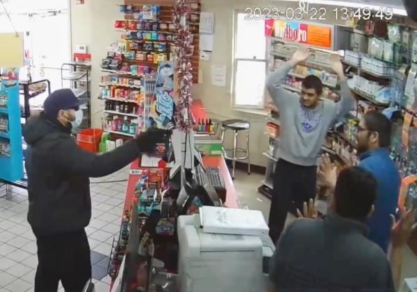 Co<em></em>nvenience store surveillance footage of an apparently phony armed robbery scheme designed to get immigrant store clerks a special 