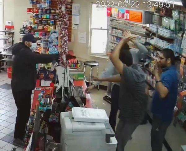 Co<em></em>nvenience store surveillance footage of an apparently phony armed robbery scheme designed to get immigrant store clerks a special 