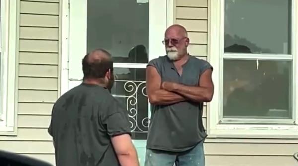 A photo of predator hunter Alex Rosen and Do<em></em>nald Letcher outside Letcher's house last month..