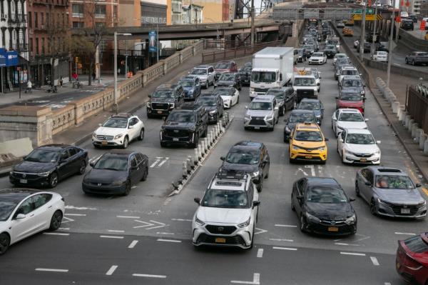Vehicles exit the Queensboro Bridge on Feb. 9, 2024 in NYC.