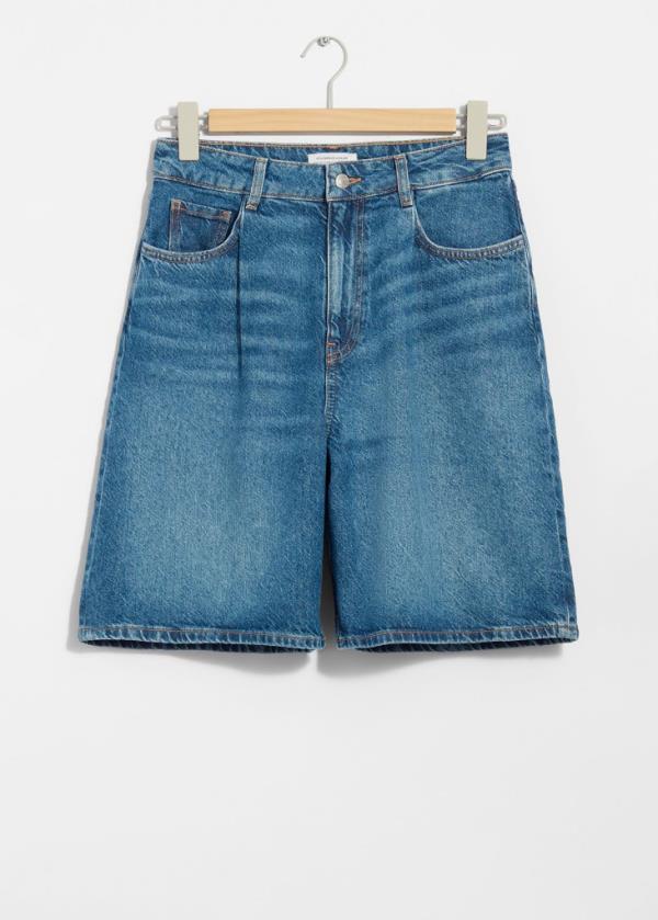 A person wearing Citizens of Humanity Marcelle Low Slung Easy Cargo Pant in blue denim