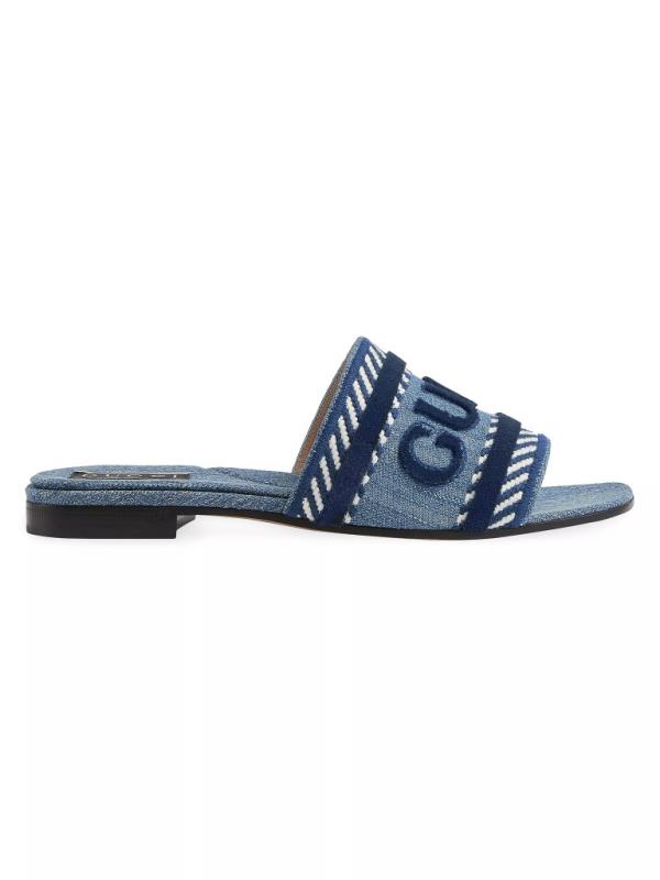 Gucci Jane Denim Slides in light blue available for purchase at Saks Fifth Avenue, styled as blue and white sandal