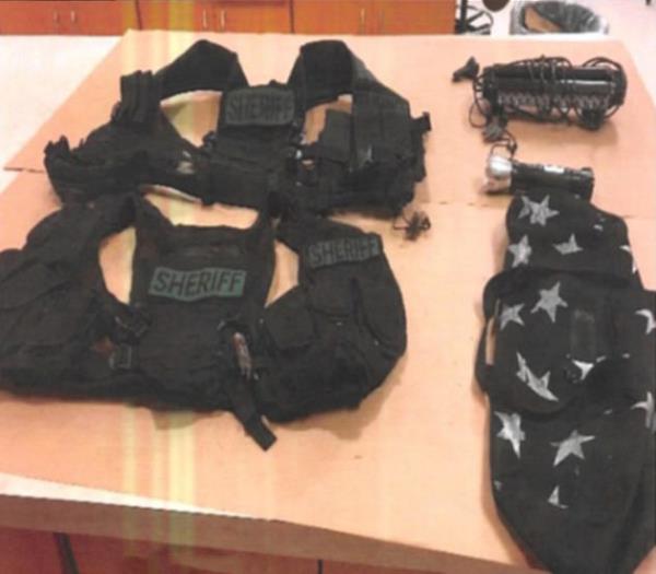 The items the group had on them to pose as law enforcement.