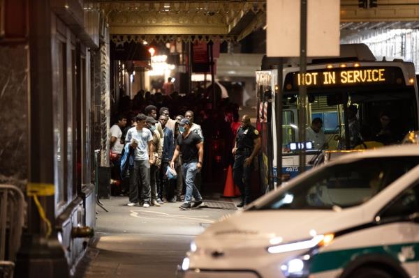Migrants arriving at the Roosevelt Hotel on a bus on August 1, 2023.