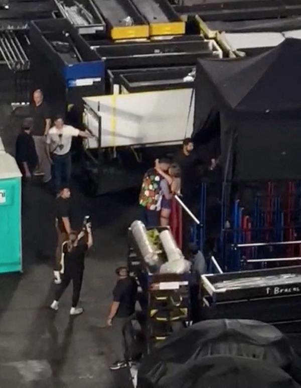 Taylor Swift embracing Travis Kelce on Eras Tour in Buenos Aires, Argentina.