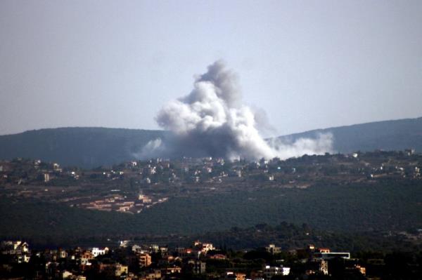 Smoke billows following an Israeli air strike on the Lebanon village of Zibqin on October 14, 2024.