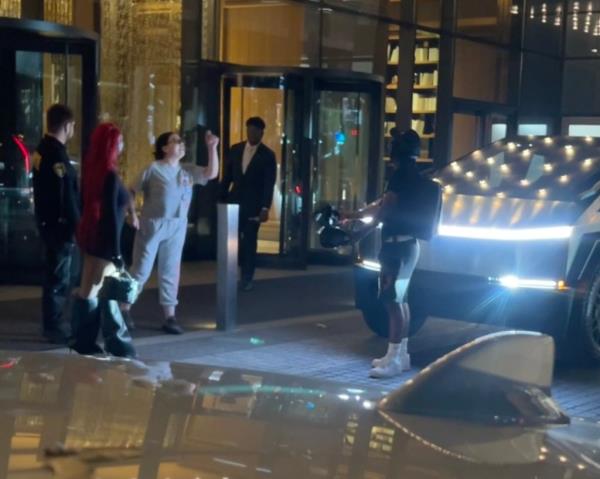 A woman is seen engaging with other members of the public in a heated argument outside an apartment building in New York City before rapper Cardi B gets involved.