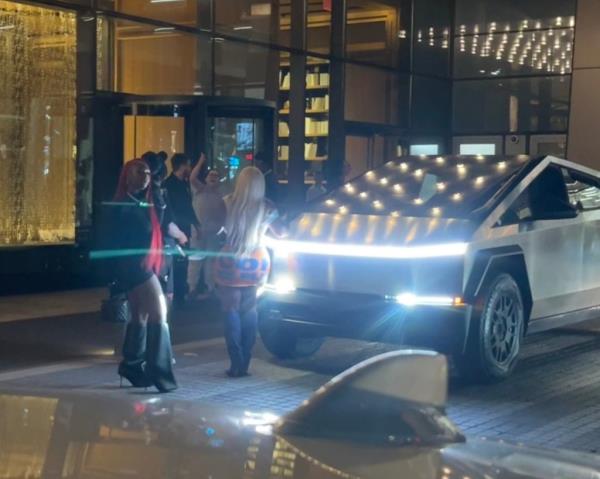 A woman is seen engaging with other members of the public in a heated argument outside an apartment building in New York City before rapper Cardi B gets involved.