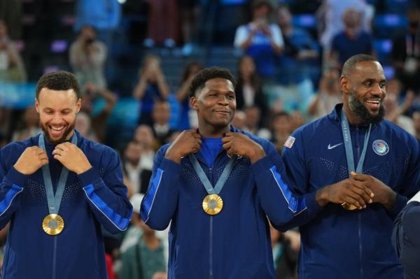 Anthony Edwards (center) rocks his Olympic Gold in between Steph Curry and LeBron James. Edwards, a two-time NBA All-Star, was Team USA's fourth-leading scorer in the Olympics.