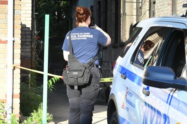 A Medical Examiners official at the scene of the fall.